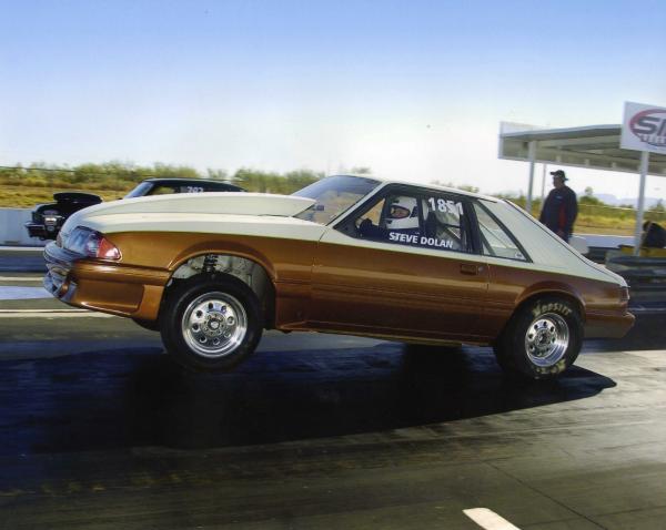 Mustang wheels up, stock rear suspension, 10" slicks.