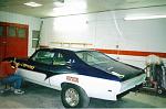 Bruce Deveau lettering the car after Allen Dame painted it.