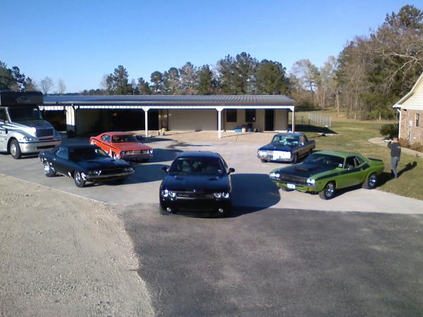 Jason's 71 Challenger T/A (green) 455 BB, Dad's 64 Plymouth Sport Fury 426 4 speed 45k orig. mi. (blue), David's 72 Duster 340, Dad's 72 Challenger 340, David's 09 Challenger SRT8 6 speed