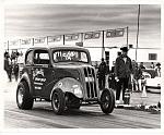 John Lane driving Ed Smith's Anglia. Removed the front fenders and ran C/A. Won class at 68 AHRA Winternationals.